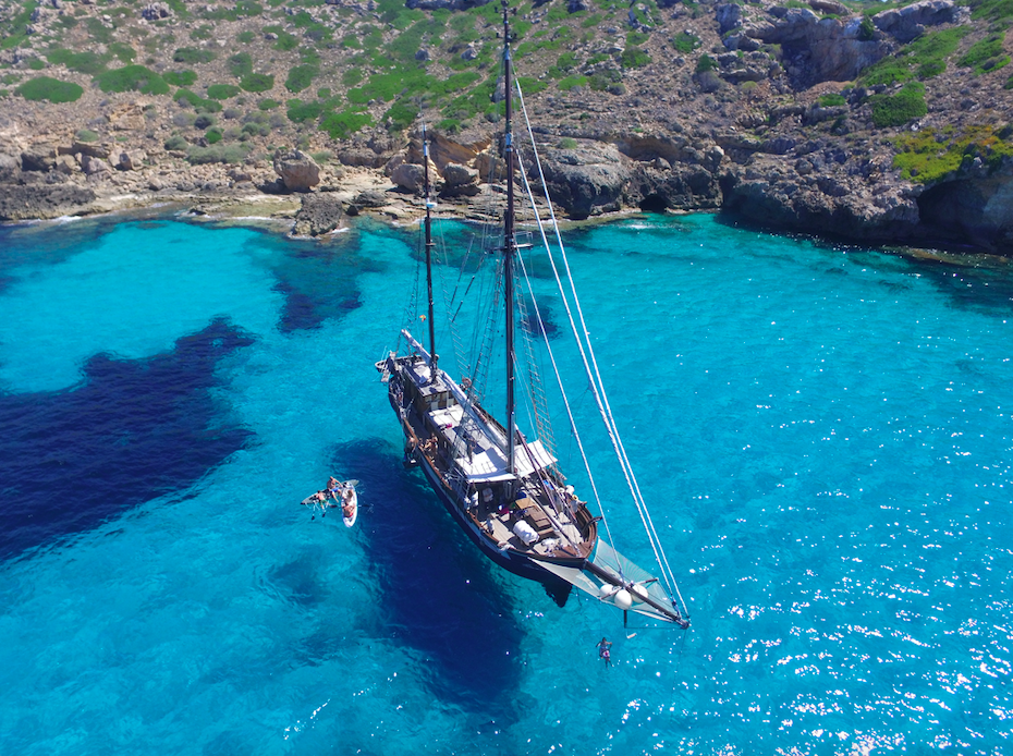 Classic sailing and swimming in turquoise Mediterranean waters